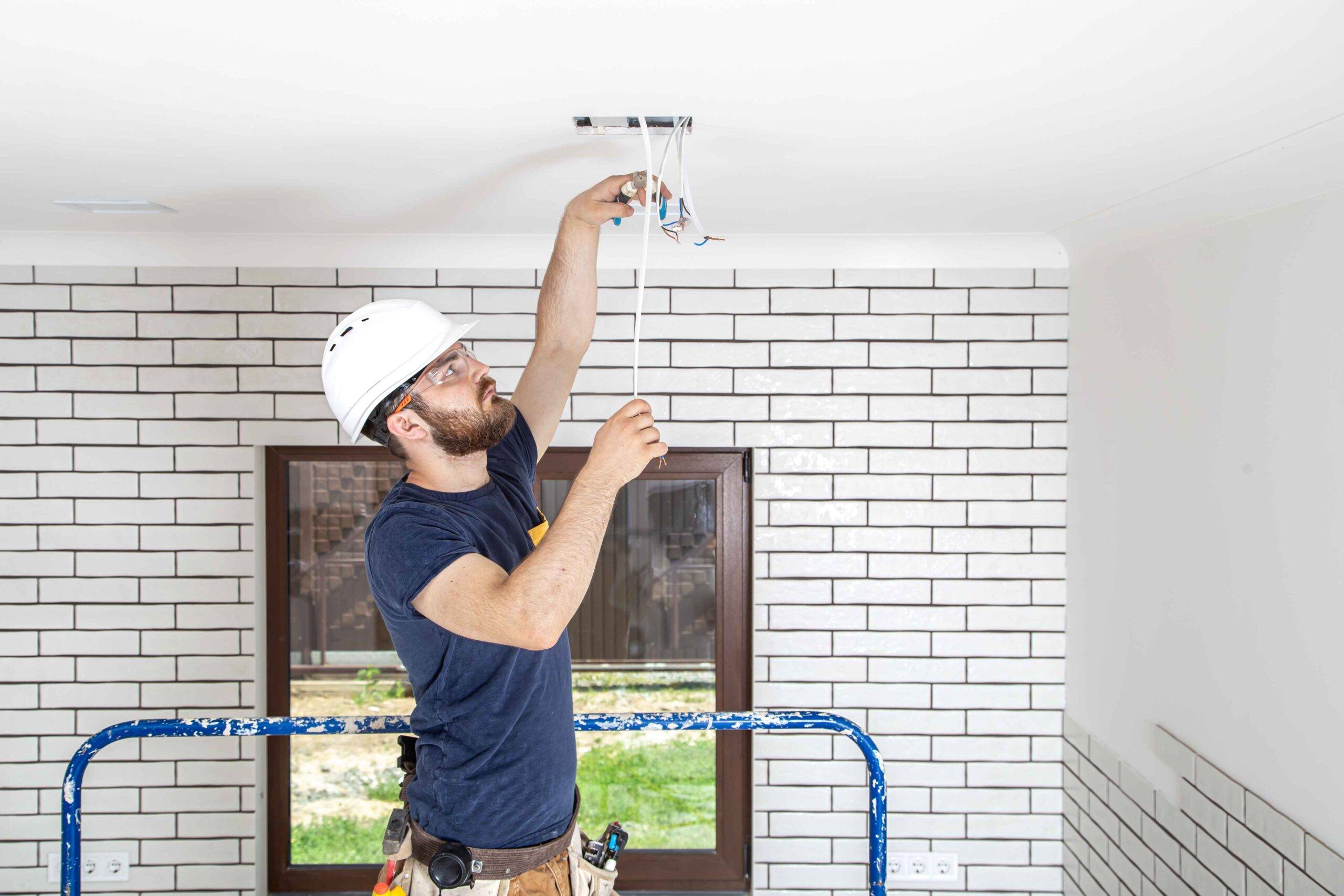 electrician-builder-at-work-installation-of-lamps-2023-11-27-05-32-56-utc_11zon